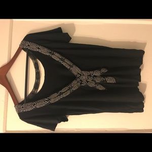 Black top with dramatic back